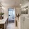 separate soaking tub and glass enclosed walk-in shower in bright bathroom