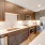 well lit kitchen with island and recessed lighting