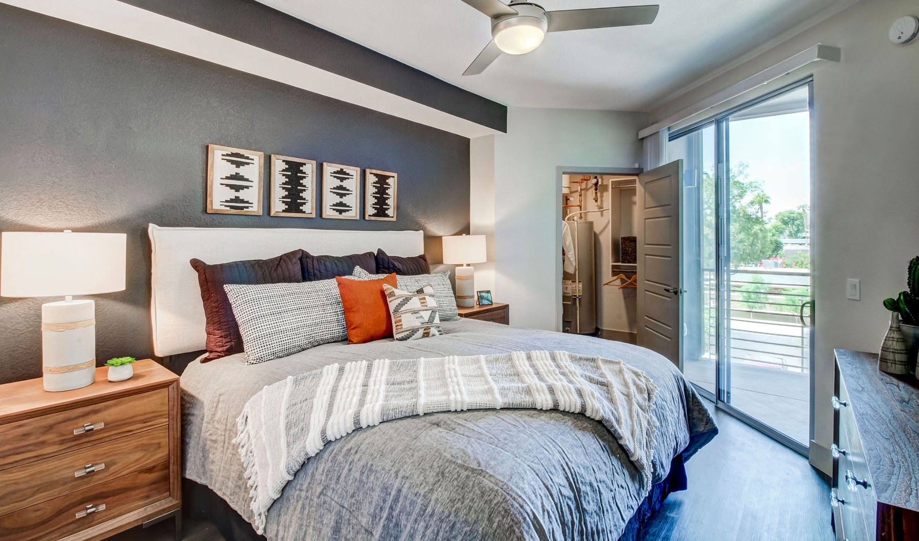 NOW OPEN! - Blending Relaxation & Sophistication to Create the Ideal Place bedroom with ceiling fan and lighting fixture